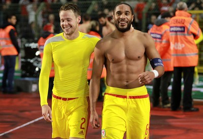 161114 - Belgium v Wales - European Championship Qualifier - Chris Gunter and Ashley Williams of Wales celebrate after the game