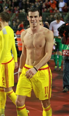 161114 - Belgium v Wales - European Championship Qualifier - Gareth Bale of Wales celebrates topless after the game