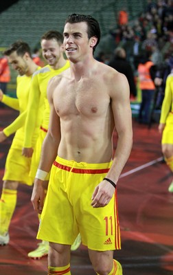 161114 - Belgium v Wales - European Championship Qualifier - Gareth Bale of Wales celebrates topless after the game