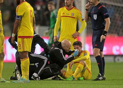 161114 - Belgium v Wales - European Championship Qualifier - Joe Allen of Wales down injured