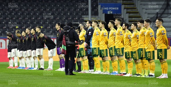 240321 - Belgium v Wales - FIFA World Cup Qualifier - Wales and Belgium players during the anthems