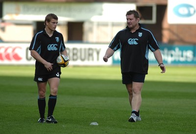 210906 - Cardiff Blues Training - Blues Ben Blair and Dai Young discuss tactics during a training session at Cardiff Arms Park 