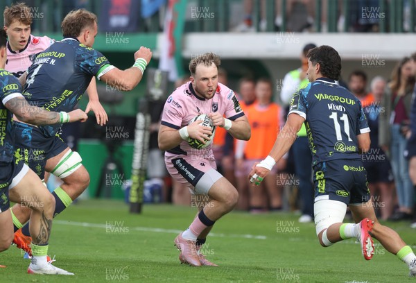 040426 - Benetton Rugby v Cardiff Rugby - EPCR Challenge Cup Round of 16 - Ioan Lloyd of Cardiff takes on Ignacio Mendy of Benetton (R)