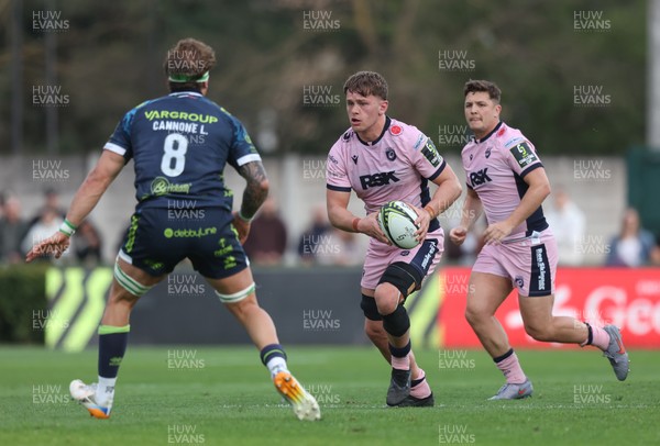 040426 - Benetton Rugby v Cardiff Rugby - EPCR Challenge Cup Round of 16 - Alex Mann of Cardiff takes on Lorenzo Cannone of Benetton as Callum Sheedy of Cardiff (R) looks on