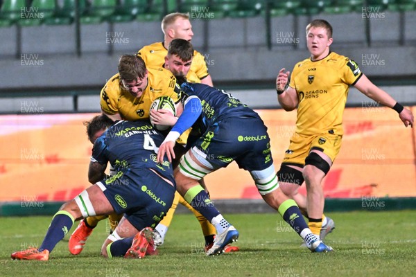 100126 - Benetton Rugby v Dragons RFC - EPCR Challenge Cup - Matthew Screech of Dragons is tackled by Matteo Canali of Zebre (4)