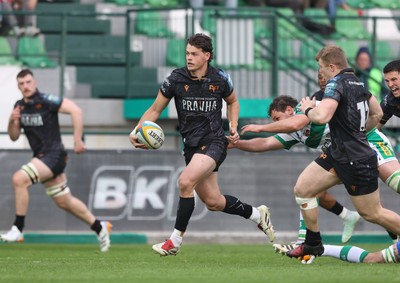 210326 - Benetton Rugby v Ospreys - United Rugby Championship - Jack Walsh of Ospreys makes a break supported by Keiran Williams of Ospreys (R)