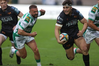 210326 - Benetton Rugby v Ospreys - United Rugby Championship - Lewis Lloyd of Ospreys gets past Andy Uren of Benetton (L)