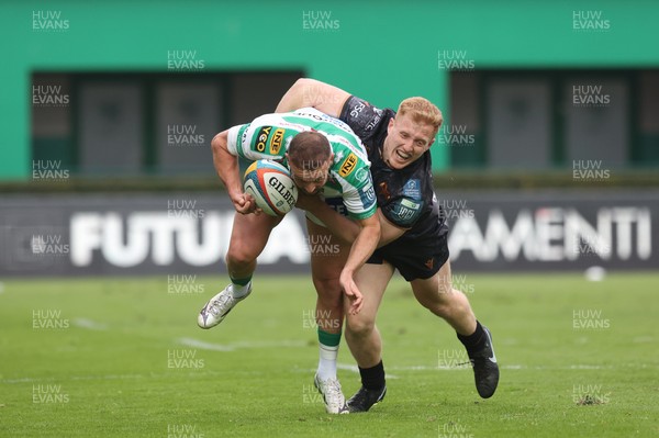 210326 - Benetton Rugby v Ospreys - United Rugby Championship - Andy Uren of Benetton is tackled by Iestyn Hopkins of Ospreys 