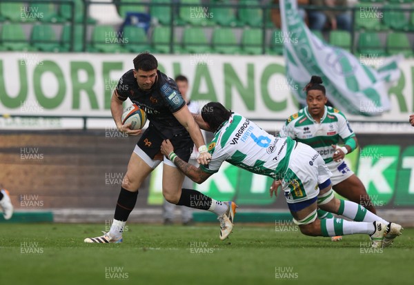 210326 - Benetton Rugby v Ospreys - United Rugby Championship - Owen Watkin of Ospreys is tackled by Riccardo Favretto of Benetton 