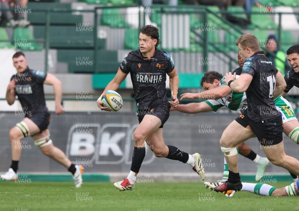 210326 - Benetton Rugby v Ospreys - United Rugby Championship - Jack Walsh of Ospreys makes a break supported by Keiran Williams of Ospreys (R)