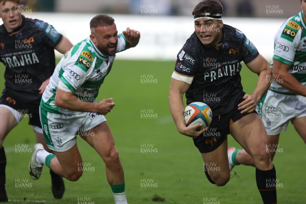 210326 - Benetton Rugby v Ospreys - United Rugby Championship - Lewis Lloyd of Ospreys gets past Andy Uren of Benetton (L)