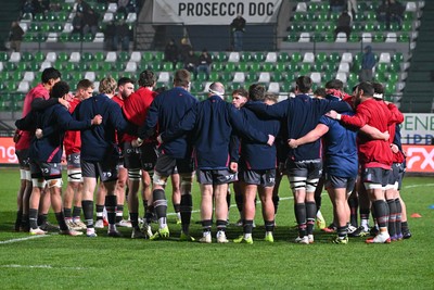 300126 - Benetton Rugby v Scarlets, United Rugby Championship - The Scarlets huddle up ahead of the match