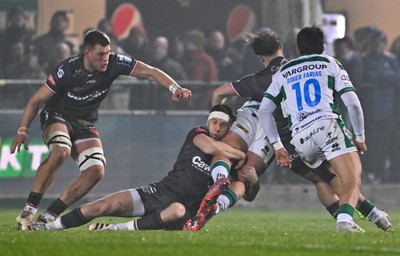 300126 - Benetton Rugby v Scarlets, United Rugby Championship - Gareth Davies of Scarlets tackles