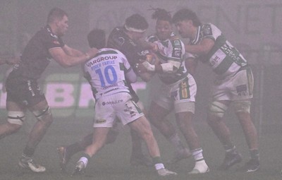 300126 - Benetton Rugby v Scarlets, United Rugby Championship - Fletcher Anderson of Scarlets is held