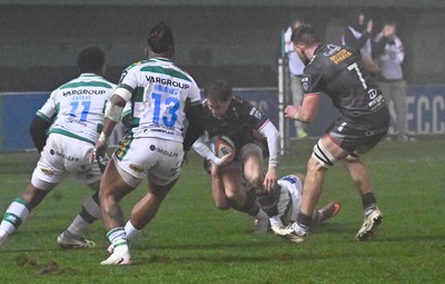 300126 - Benetton Rugby v Scarlets, United Rugby Championship - Macs Page of Scarlets is tackled