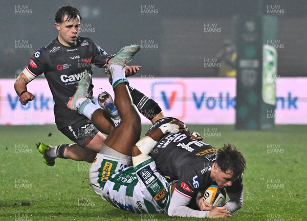300126 - Benetton Rugby v Scarlets, United Rugby Championship - Macs Page of Scarlets is tackled by Paolo Odogwu of Benetton Rugby as Carwyn Leggatt-Jones of Scarlets supports