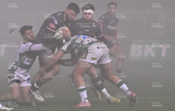 300126 - Benetton Rugby v Scarlets, United Rugby Championship - Tomi Lewis of Scarlets is tackled