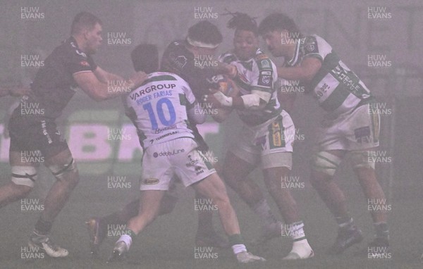 300126 - Benetton Rugby v Scarlets, United Rugby Championship - Fletcher Anderson of Scarlets is held