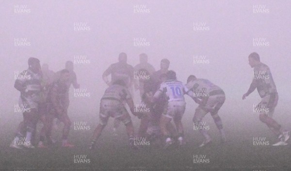 300126 - Benetton Rugby v Scarlets, United Rugby Championship - Benetton and Scarlets play on as the visibility worsens