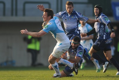 19.11.11 - Benetton Treviso v Ospreys - Heineken Cup - Tommy Bowe of Ospreys beat the tackle of Robert Barbieri of Benetton Treviso to score try. 