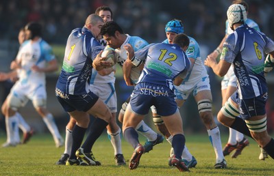 19.11.11 - Benetton Treviso v Ospreys - Heineken Cup - George Stowers of Ospreys is tackled by Alberto Sgarbi of Benetton Treviso. 