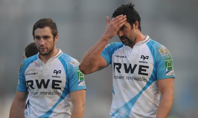 19.11.11 - Benetton Treviso v Ospreys - Heineken Cup - Andrew Bishop and Jonathan Thomas of Ospreys look dejected at the end of the game. 