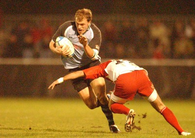 100104  Biarritz v Cardiff Blues  Cardiff's Craig Morgan is tackled by Phillipe Bernat-Salles  