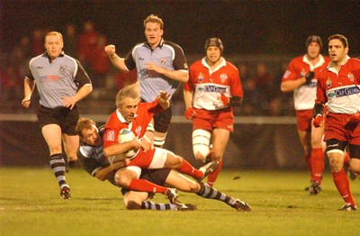 100104  Biarritz v Cardiff Blues  Biarritz Philipe Bernat-Salles feels the force of tackle by Craig Morgan  