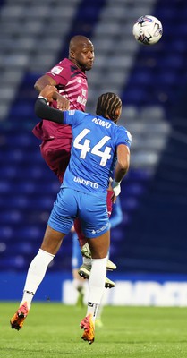 100424 - Birmingham City v Cardiff City - Sky Bet Championship - Yakou Meite of Cardiff and Emanuel Aiwu of Birmingham City