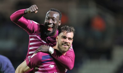 100424 - Birmingham City v Cardiff City - Sky Bet Championship - Famara Diedhiou of Cardiff hitches a lift on the back of Demitrios Goutas of Cardiff at the end of the match