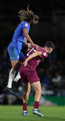 100424 - Birmingham City v Cardiff City - Sky Bet Championship - Dion Sanderson of Birmingham City hitches a lift on back of Rubin Colwill of Cardiff