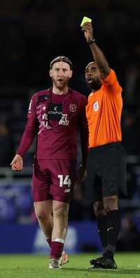 100424 - Birmingham City v Cardiff City - Sky Bet Championship - Jordan James of Birmingham City with torn shirt while ref holds up a yellow card to the Birmingham player