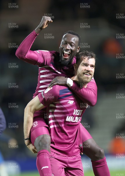 100424 - Birmingham City v Cardiff City - Sky Bet Championship - Famara Diedhiou of Cardiff celebrates on the back of Demitrios Goutas of Cardiff at the end of the match