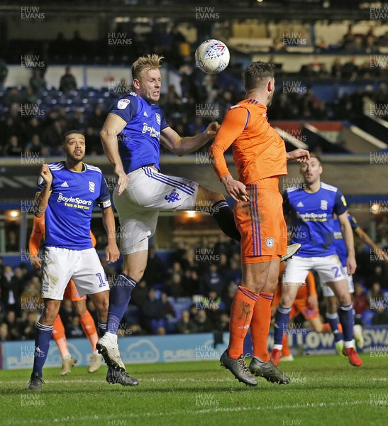 180120 - Birmingham City v Cardiff City - Sky Bet Championship - Marc Roberts of Birmingham City reaches the high ball just before Sean Morrison of Cardiff