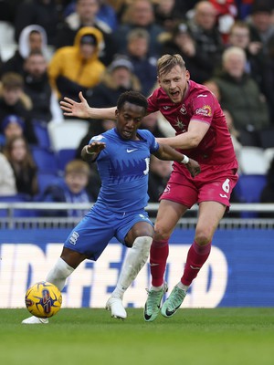 130124 - Birmingham City v Swansea City, EFL Sky Bet Championship - Siriki Dembele of Birmingham City and Harry Darling of Swansea City compete for the ball