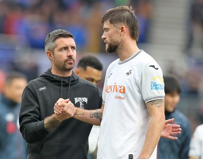 200925 - Birmingham City v Swansea City - Sky Bet Championship - Swansea manager Alan Sheehan with Cameron Burgess of Swansea at the end of the match