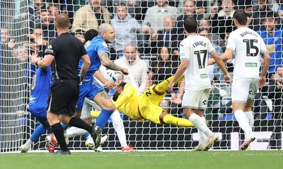 200925 - Birmingham City v Swansea City - Sky Bet Championship - Lyndon Dykes of Birmingham puts the ball past Goalkeeper Lawrence Vigouroux of Swansea for the only goal of the match in added time