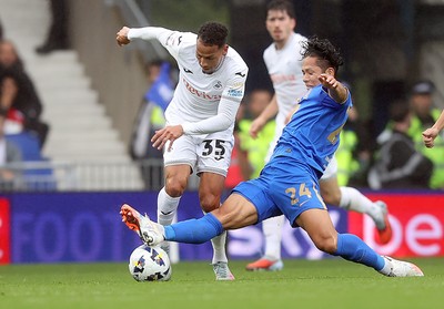 200925 - Birmingham City v Swansea City - Sky Bet Championship - Tomoki Iwata of Birmingham makes sliding tackle on Ronald of Swansea