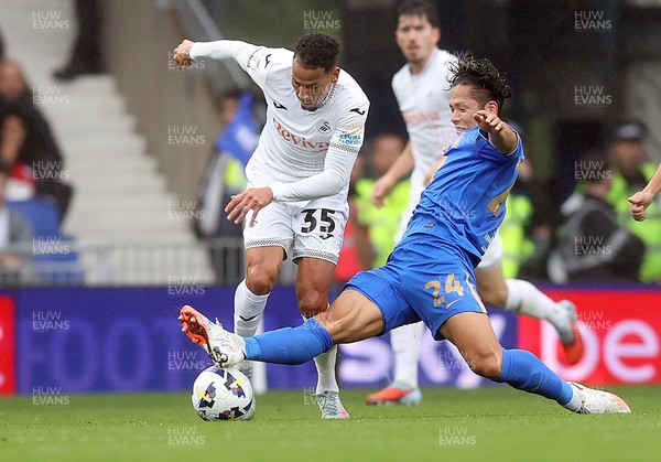 200925 - Birmingham City v Swansea City - Sky Bet Championship - Tomoki Iwata of Birmingham makes sliding tackle on Ronald of Swansea