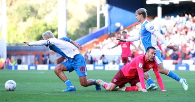 101026 - Blackburn Rovers v Cardiff City - Sky Bet Championship - Jack Moylan of Cardiff tries to pass Todd Cantwell of Blackburn and Jake Garrett of Blackburn