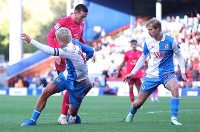 101026 - Blackburn Rovers v Cardiff City - Sky Bet Championship - Jack Moylan of Cardiff tries to pass Todd Cantwell of Blackburn and Jake Garrett of Blackburn