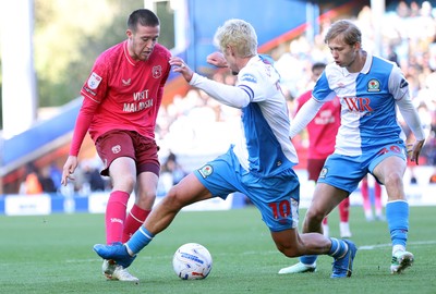 101026 - Blackburn Rovers v Cardiff City - Sky Bet Championship - Jack Moylan of Cardiff tries to pass Todd Cantwell of Blackburn and Jake Garrett of Blackburn