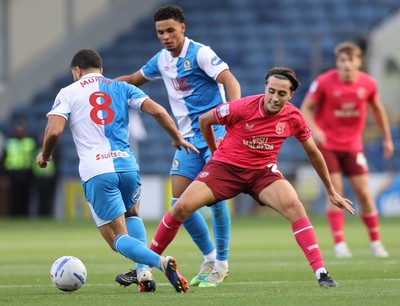 101026 - Blackburn Rovers v Cardiff City - Sky Bet Championship - Joel Colwill of Cardiff tries to grab the ball away from Sam Morsy of Blackburn and Kristi Montgomery of Blackburn