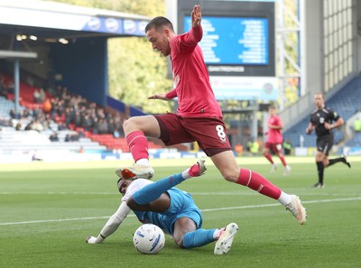 101026 - Blackburn Rovers v Cardiff City - Sky Bet Championship - Jack Moylan of Cardiff and Ryan Alebiosu of Blackburn try to get to the ball