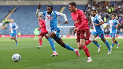 101026 - Blackburn Rovers v Cardiff City - Sky Bet Championship - Jack Moylan of Cardiff and Ryan Alebiosu of Blackburn try to get to the ball