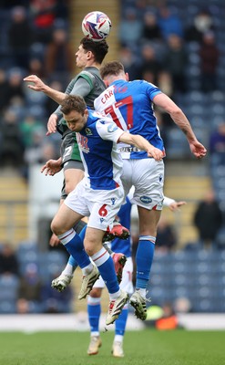 150325 - Blackburn Rovers v Cardiff City - Sky Bet Championship - Yousef Saleh of Cardiff rises above Sondre Tronstad of Blackburn and Hayden Carter of Blackburn