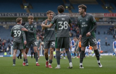 150325 - Blackburn Rovers v Cardiff City - Sky Bet Championship - Calum Chambers of Cardiff celebrates at the end of the match with Perry Ng of Cardiff and Alves