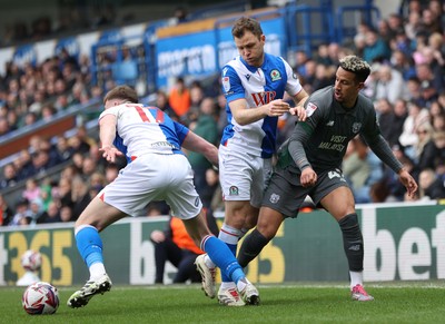 150325 - Blackburn Rovers v Cardiff City - Sky Bet Championship - Callum Robinson of Cardiff is held back by Hayden Carter of Blackburn and Sondre Tronstad of Blackburn