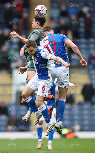 150325 - Blackburn Rovers v Cardiff City - Sky Bet Championship - Yousef Saleh of Cardiff rises above Sondre Tronstad of Blackburn and Hayden Carter of Blackburn