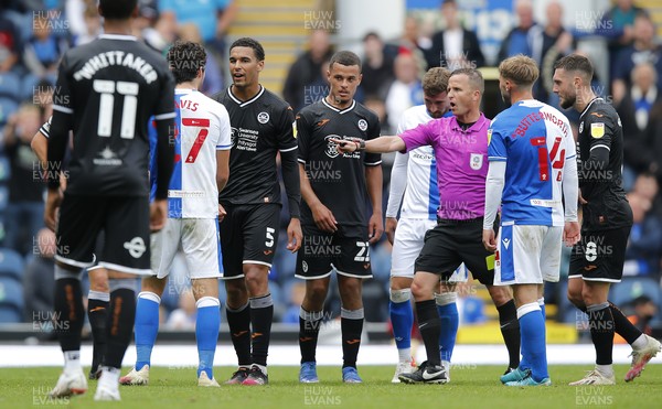 070821 - Blackburn Rovers v Swansea City - Sky Bet Championship - Ben Cabango of Swansea and Lewis Travis of Blackburn Rovers square up under the eye of the referee